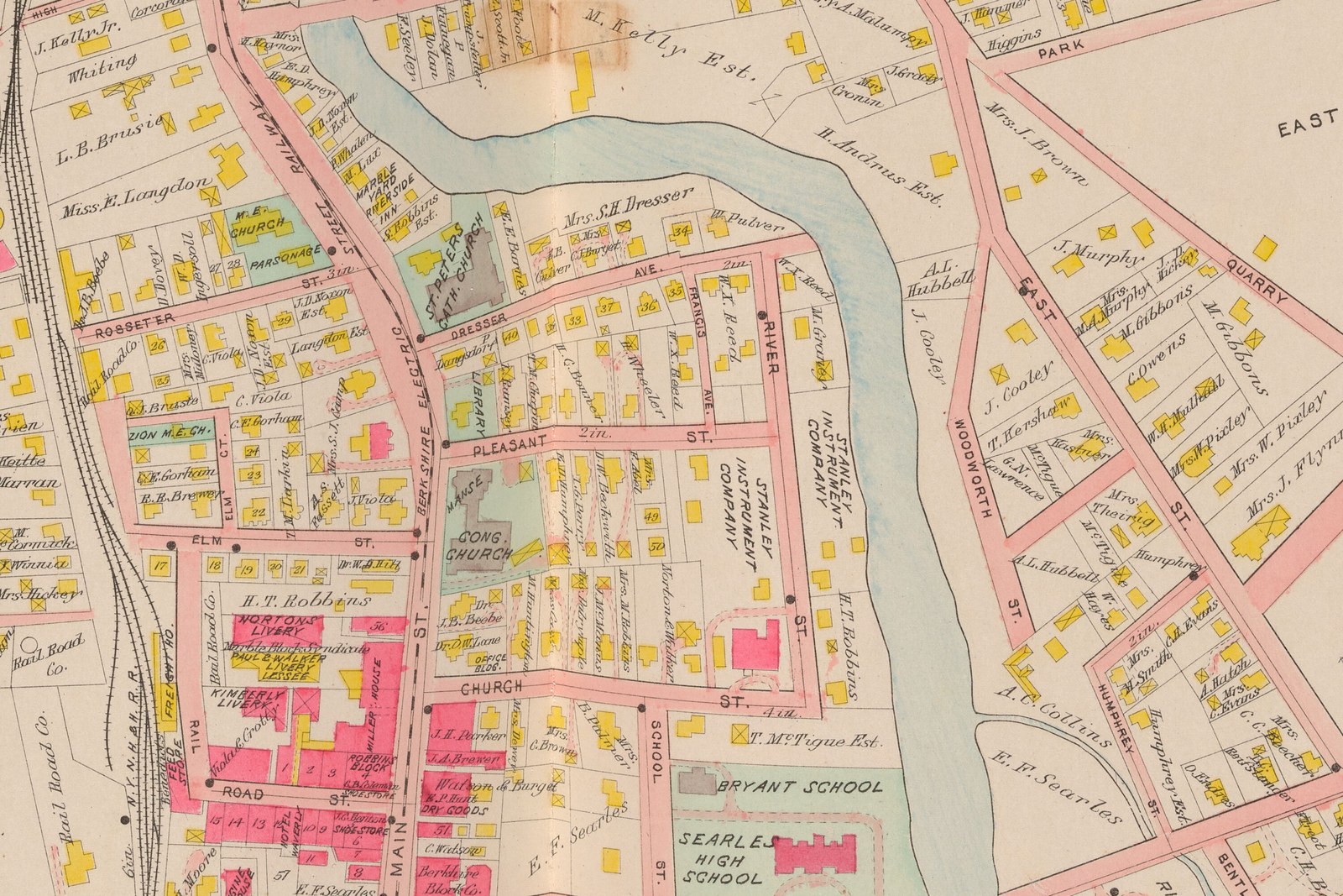 Plate 34, Great Barrington: two blocks lettered STANLEY INSTRUMENT COMPANY, either side of River Street between Pleasant and Church. The land is largely open, scattered with small wooden houses. The one substantial building on either parcel is the brick house-form block with a curved carriage drive at the corner of River and Church, and the plate does not letter it.