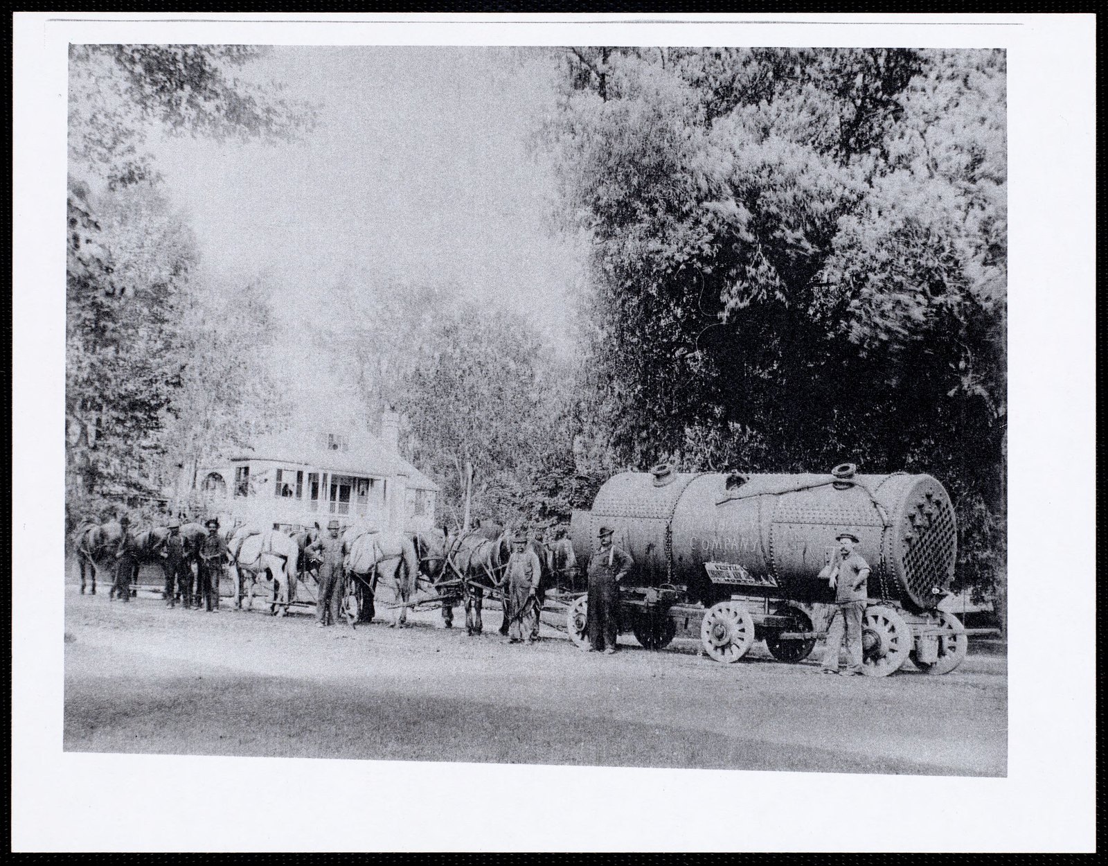 At foot of Church Hill, steam boiler for Aspinwall Hotel pulled by team of 10 horses. about 1870–1954.