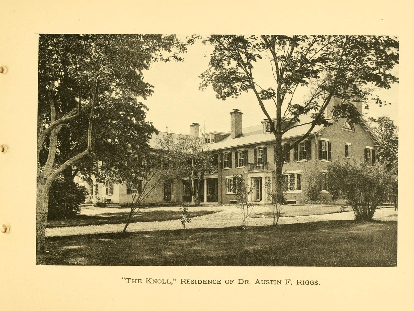 “The Knoll,” residence of Dr. Austin F. Riggs — so captioned in Glimpses of Stockbridge, with the name spelled Austin. A long brick house with a portico and a second, lighter wing.