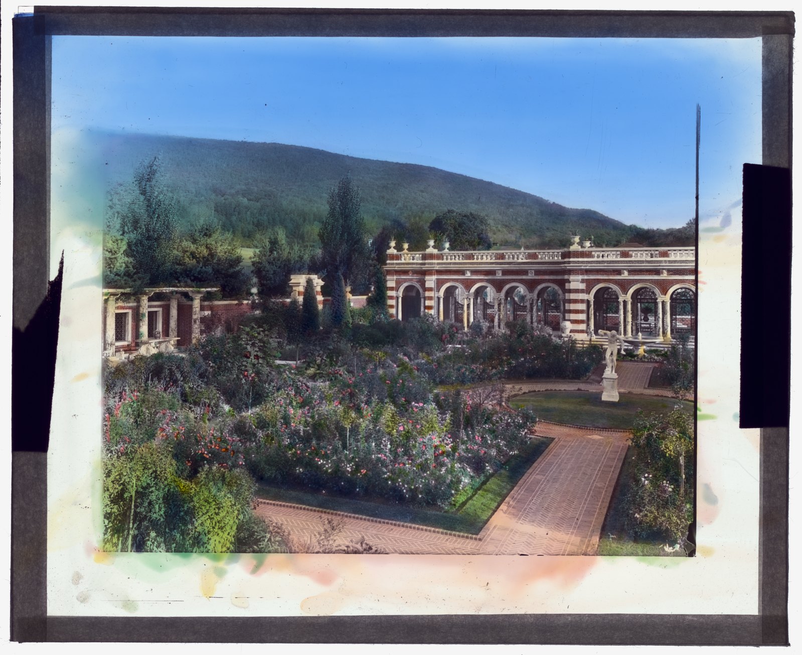The perennial garden and its casino, about 1916 — a hand-colored lantern slide by Frances Benjamin Johnston.