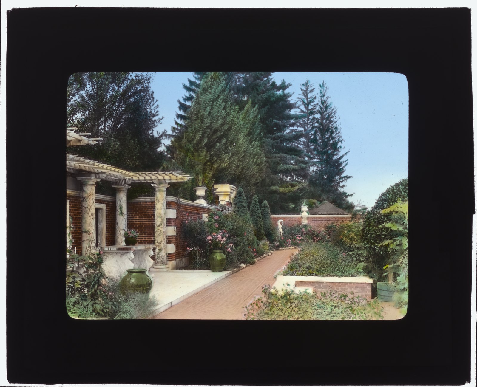 “Perennial Garden pergola steps.” The same structure from the other end, with urns on the piers.