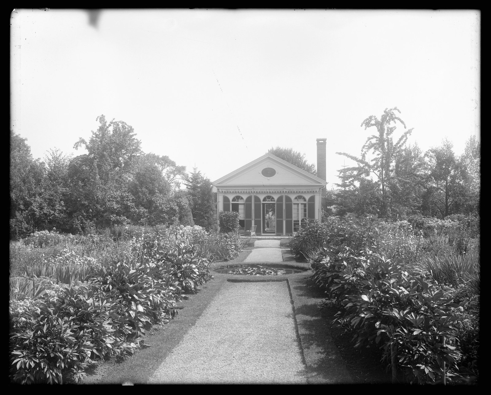 Coldbrook: garden with pool and summer-house, about 1892–1915.
