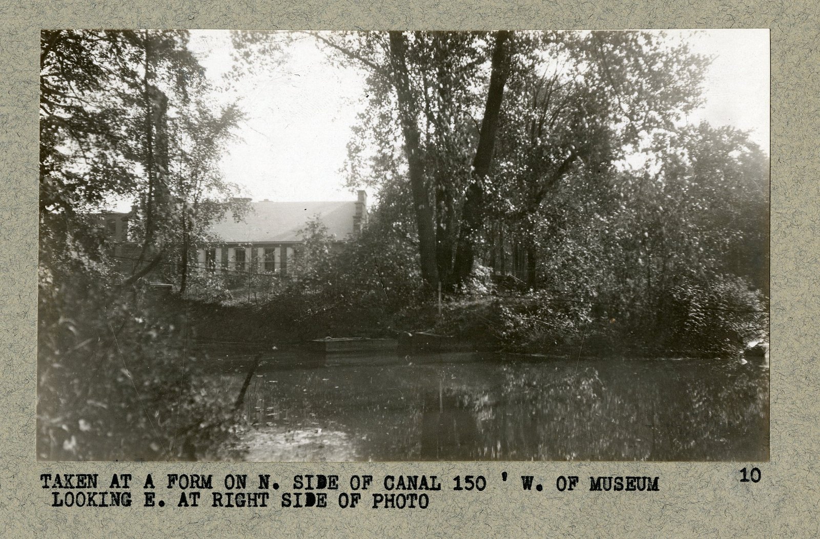 “TAKEN AT A FORM ON N. SIDE OF CANAL 150’ W. OF MUSEUM LOOKING E. AT RIGHT SIDE OF PHOTO.”