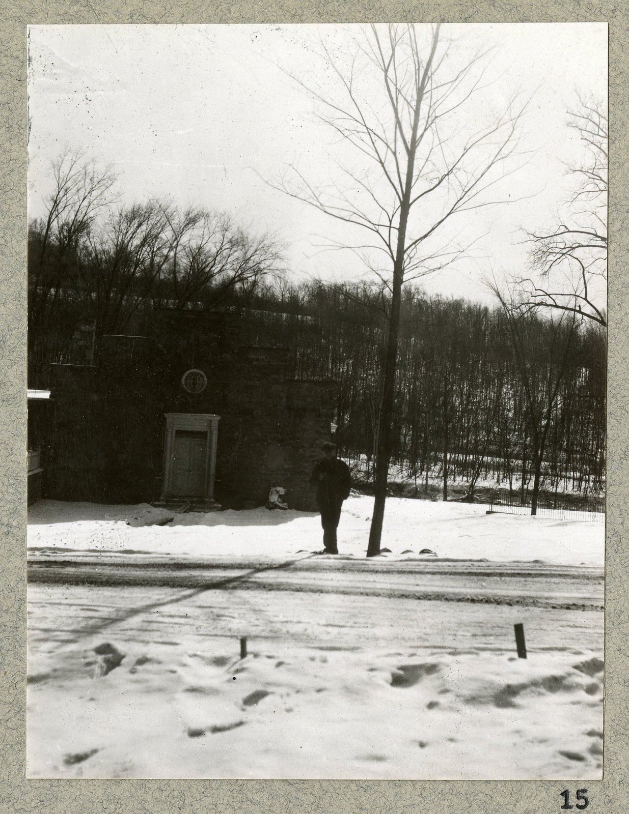 A figure on the new walk, the museum door beyond.
