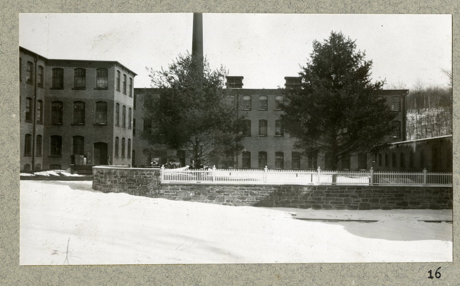 The mills and the finished wall along the road.