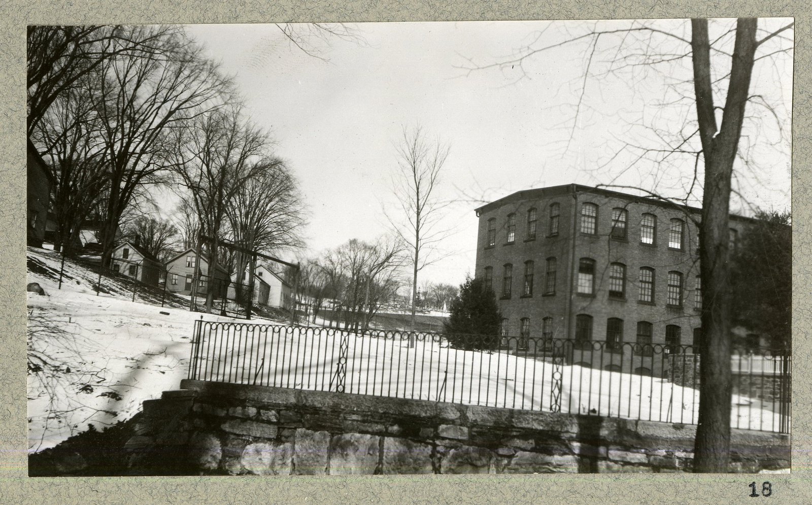 The wall and fence running down to the mill.
