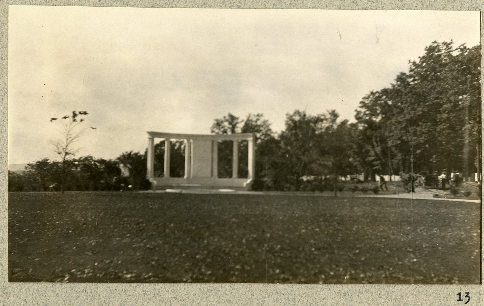 The memorial from the lawn, with people at the far end. Print 13.