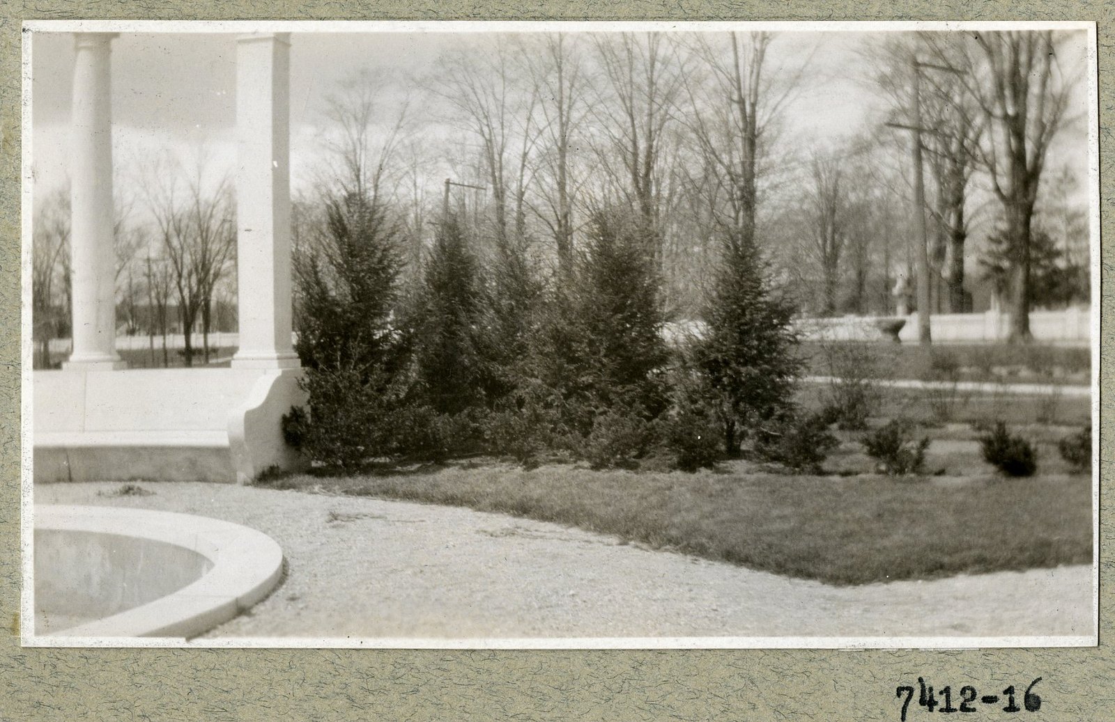 Evergreens set around the basin, from inside the colonnade. Print 7412-16.