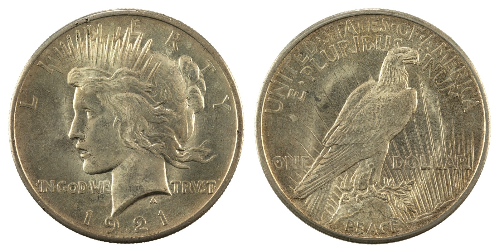 The Peace dollar of 1921, in high relief. The dies did not survive the run; production stopped on 10 January 1922 and the relief was cut down. A broken sword beneath the eagle had already been removed in December 1921, after criticism that it “carries with it only unpleasant associations.”