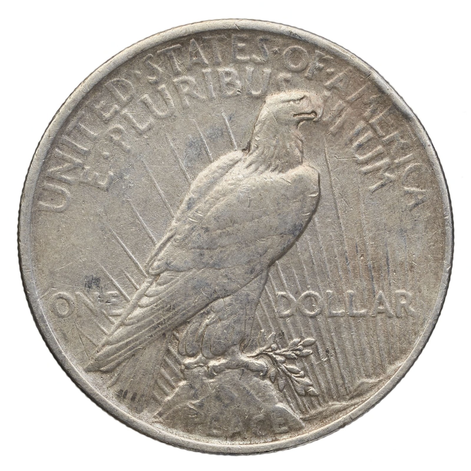 The reverse: an eagle at rest on a rock, an olive branch in its talons, and the word PEACE.