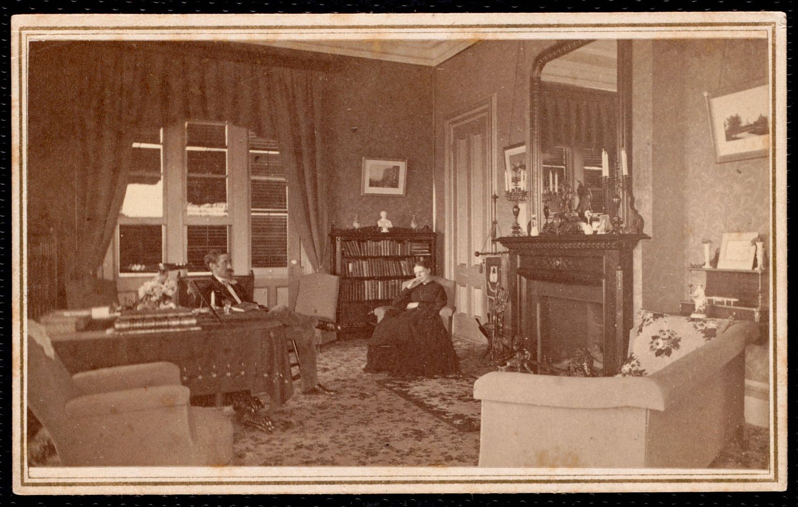 Dormers: man and woman seated in parlor. About 1880–1897.