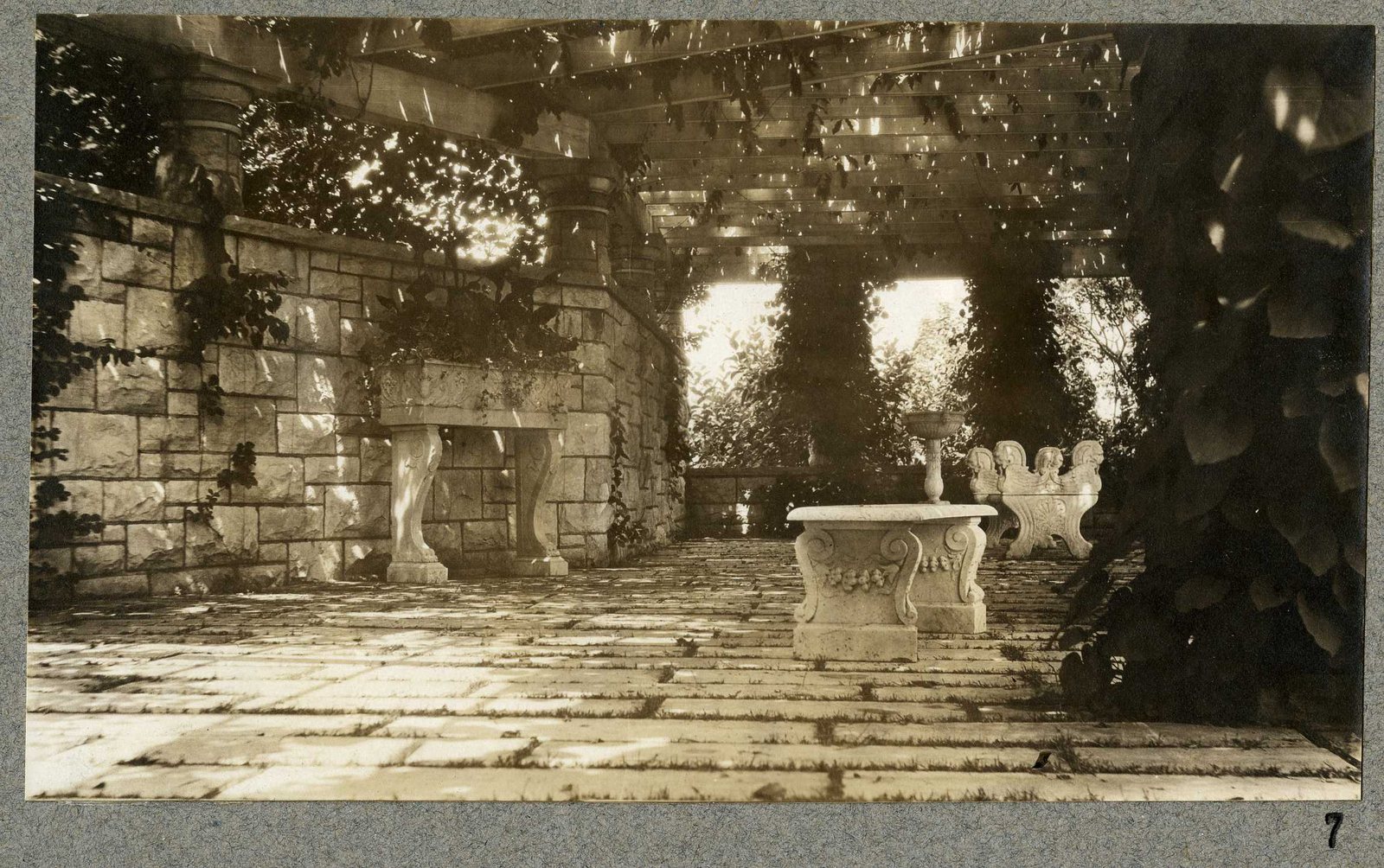 Photograph 7, July 1924. Stone seats under the pergola.