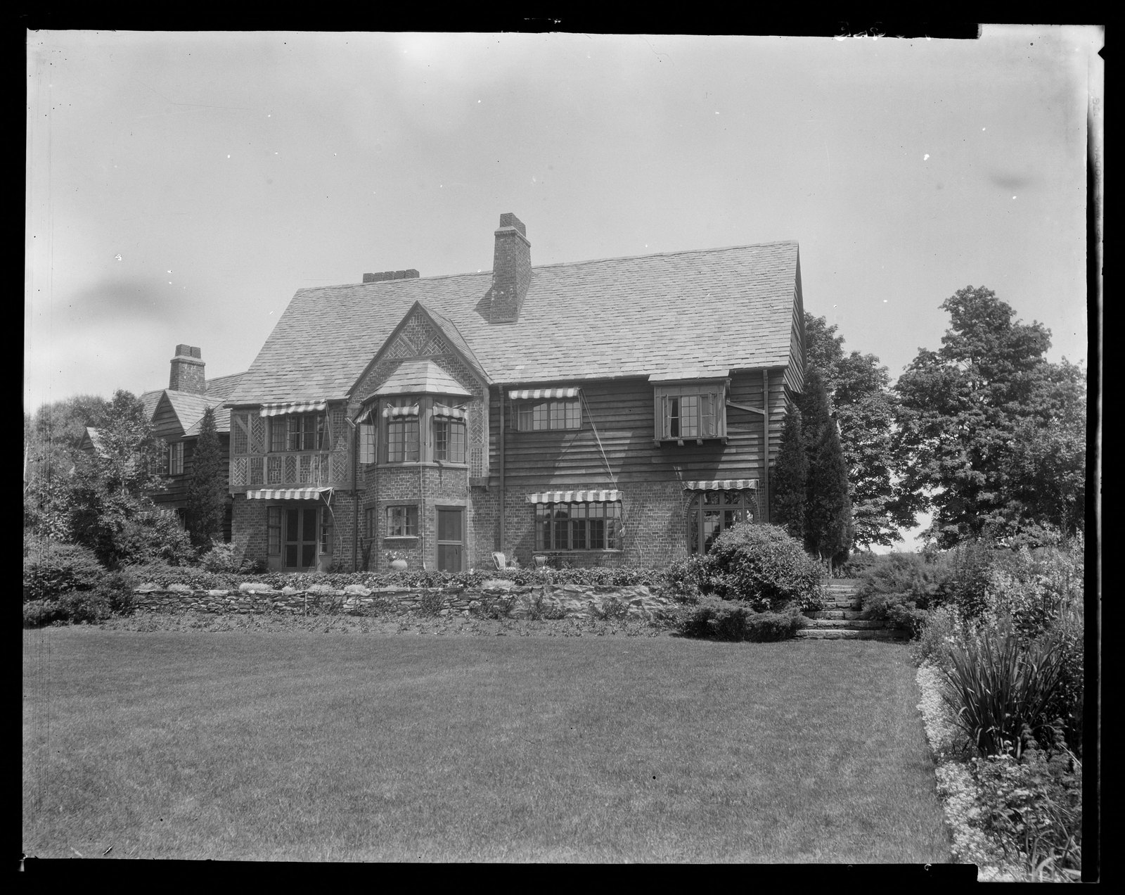 House & lawn. About 1925–1935.