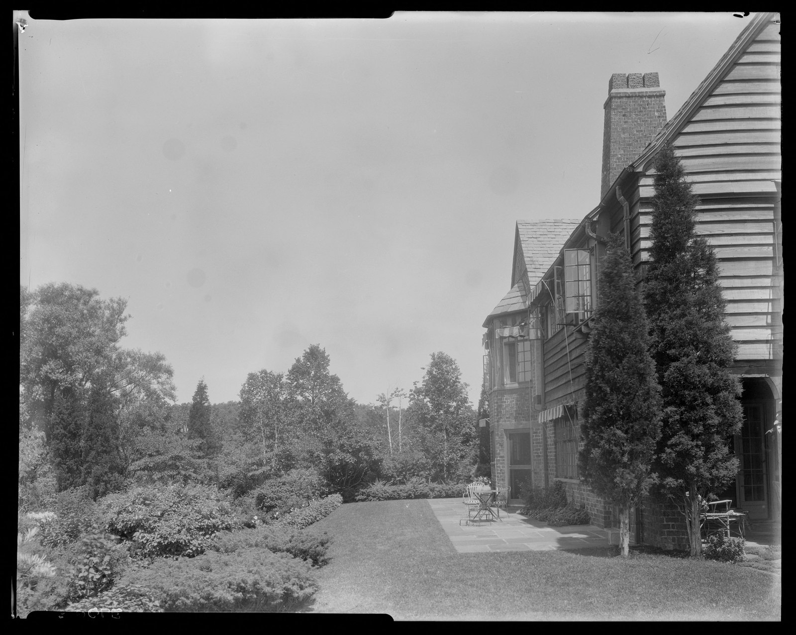 House & lawn. About 1925–1935.
