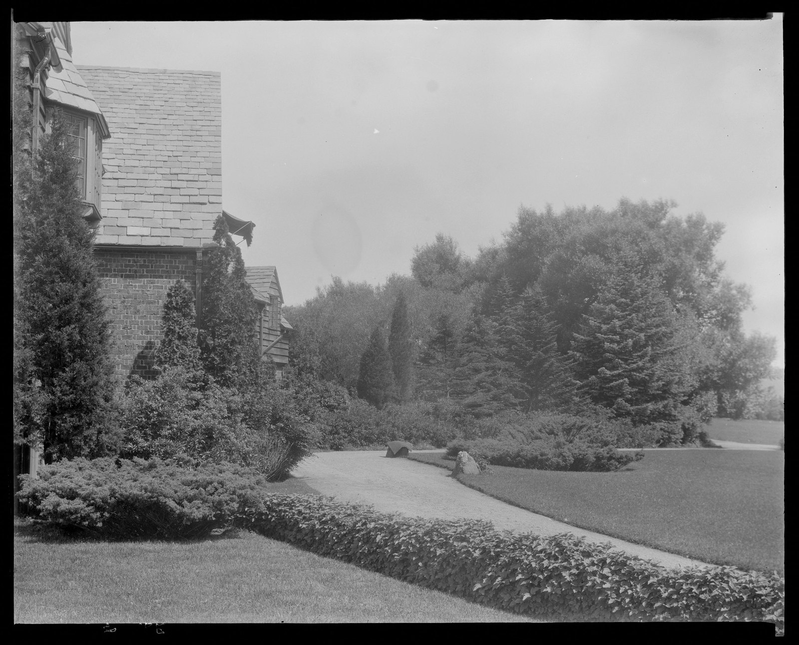 House & drive. About 1925–1935.
