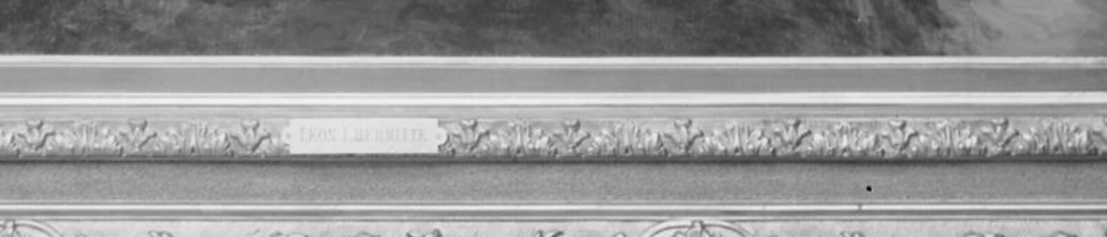 An engraved brass plaque on the lower rail of a gilt picture frame, reading LEON LHERMITTE