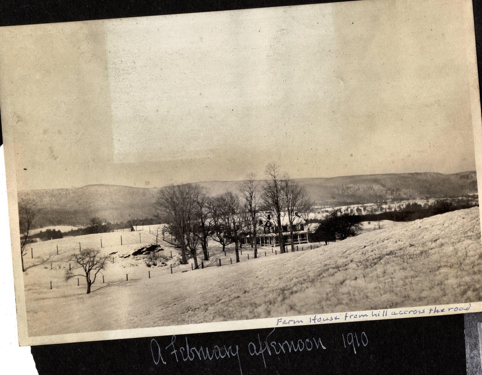 Farm House from hill accross the road — the spelling is the album’s. On the page below the print, in a second hand: A February afternoon 1910.