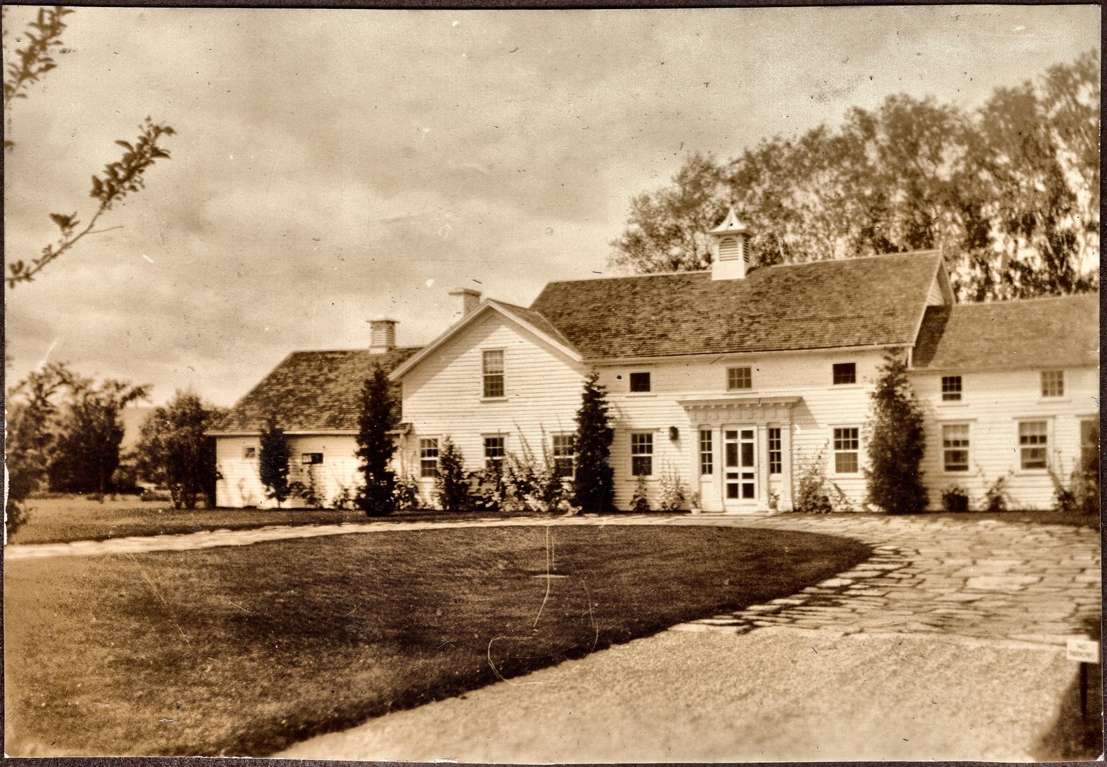 The farm house from the drive, the cupola over the center of the roof. From the run of pages dated 1934.