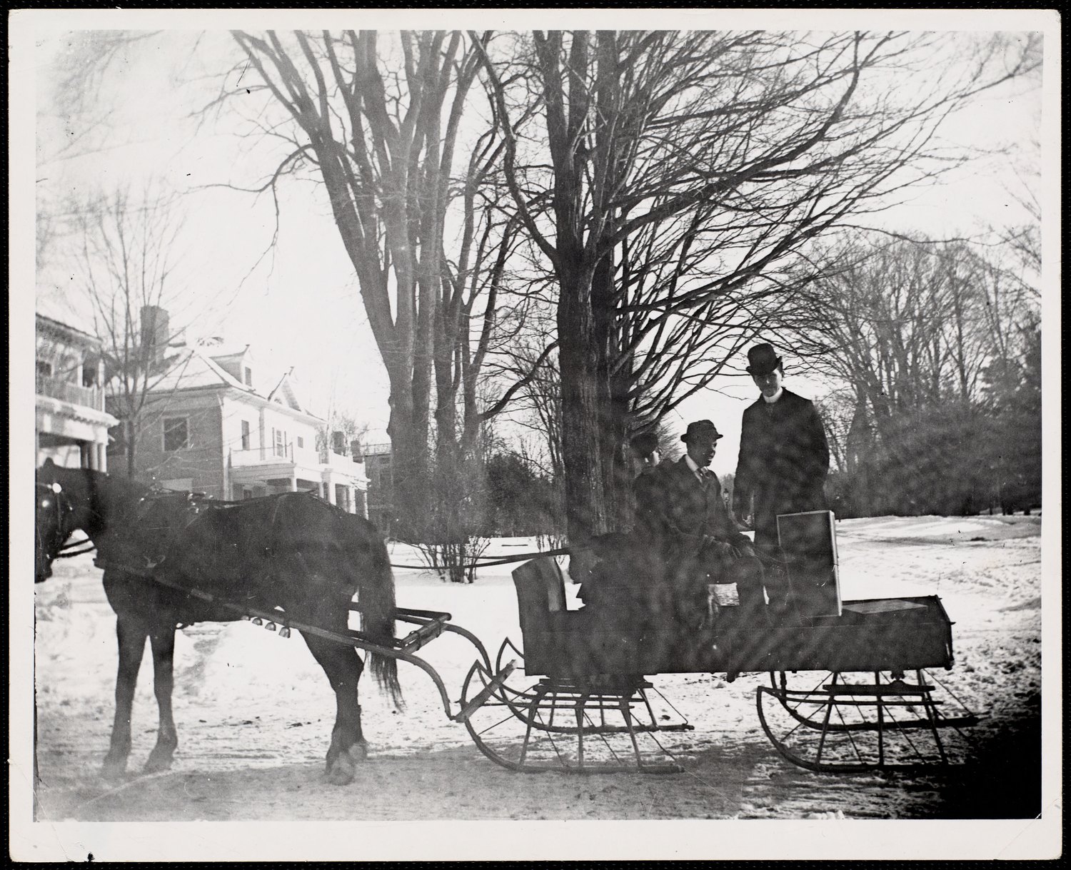 Lenox: Walker Street looking toward Trinity, about 1912 to 1920 — a horse and two sleighs standing in the road. The back of the print is inscribed, left to right, Candle light, Regnier, Gateways.