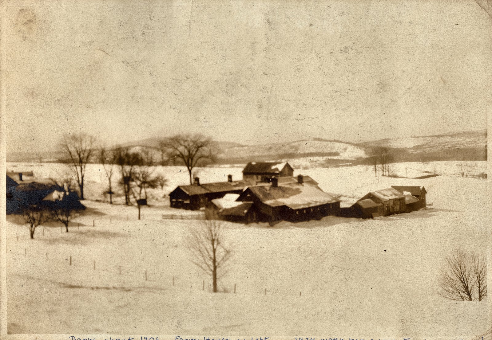 Barns about 1906. Farm House on left. A second hand has added: 1974 many barns gone. Torn down or burned.