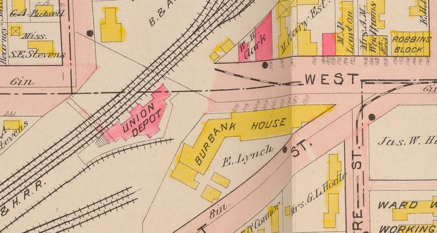Plate 2, detail. UNION DEPOT in pink for brick, a wedge on the fork between the B. & A. R. R. CO. and the N.Y.C. & H. R.R., with the platform hatched along its south-west face. WEST ST. comes in from the east and stops at the tracks. BURBANK HOUSE, in yellow for wood, stands immediately south-east of it — in 1913 the New York, New Haven and Hartford bought that property and built the next station on it.