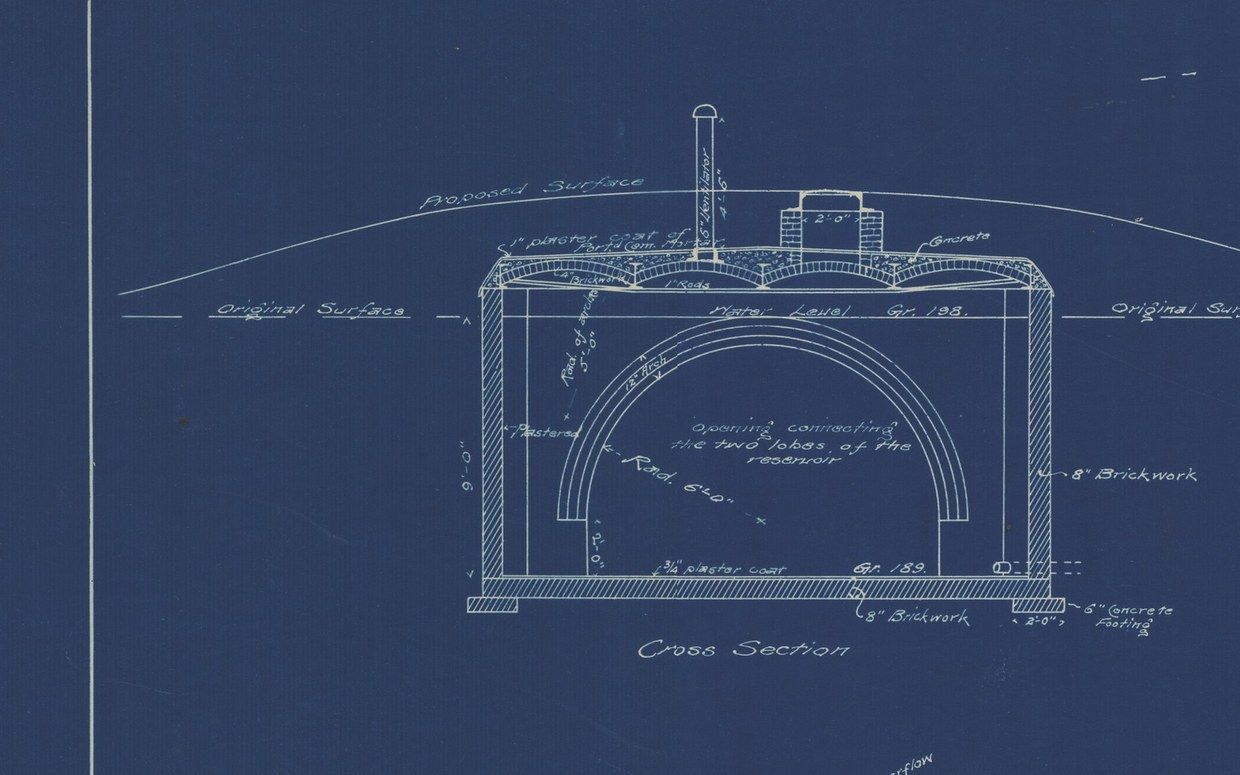 Plan 115, detail. Cross section of the 25,000-gallon reservoir. The mound over it is drawn as “Proposed Surface” above the original ground.