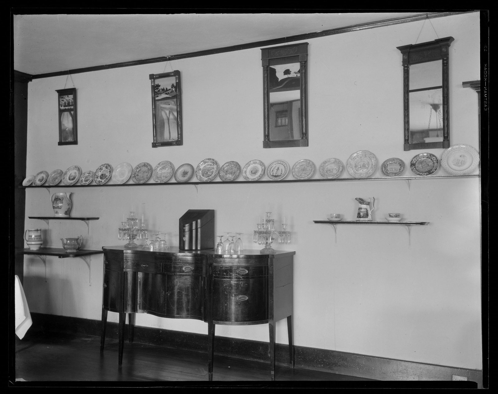 Red Lion Inn: interior/wall with furniture, plates & mirrors. About 1925–1933.