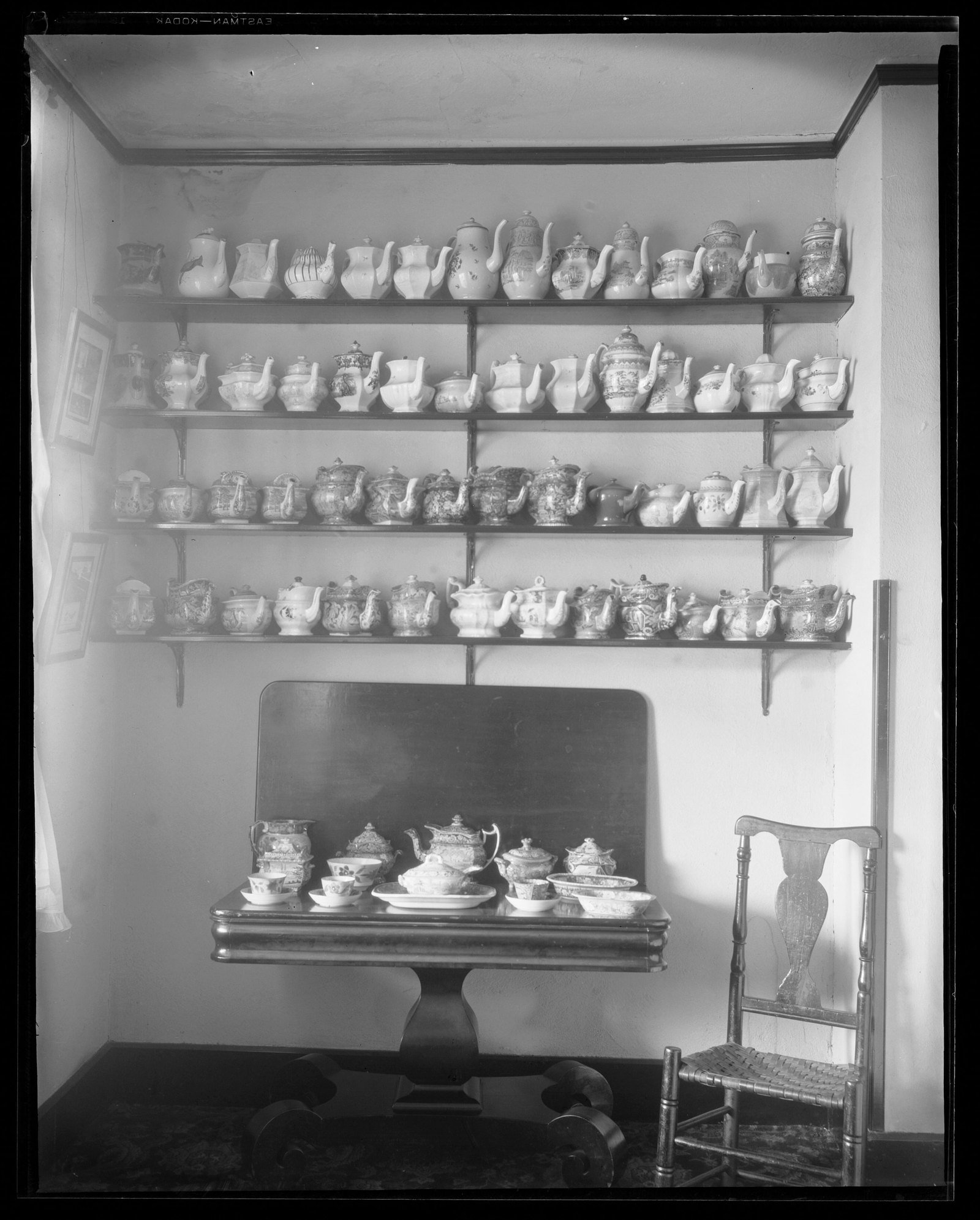 Red Lion Inn: interior/shelf of tea kettles. About 1925–1933.