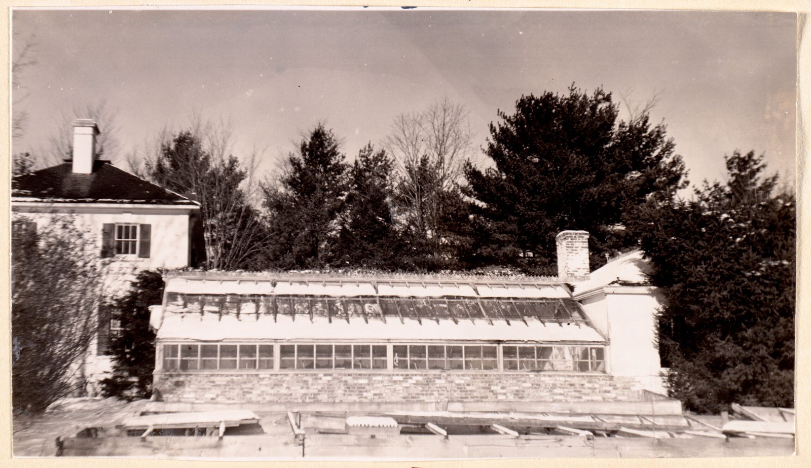 Item #2, greenhouse — a long glazed range with its cold frames out front.