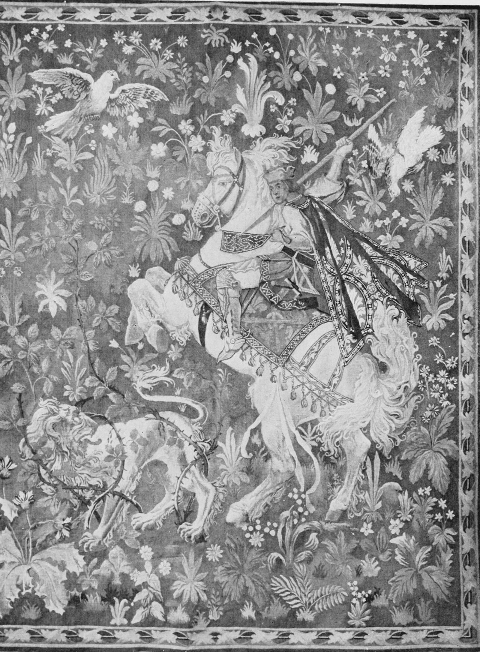 A Late Gothic hunting tapestry — a knight and a lion in a field of flowers — designed in America and woven at Williamsbridge. Everything about it says about 1500. It was made within walking distance of the Bronx River.