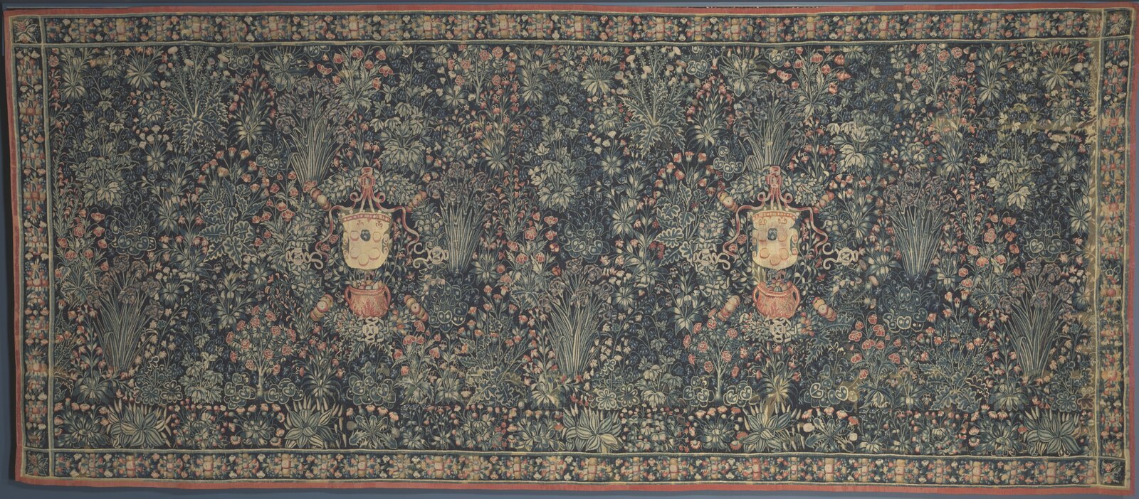 Twenty-one feet five inches long and eight feet eleven high: a millefleurs hanging woven in Hainault in the 1520s, with the Medici arms twice over in the flowers.