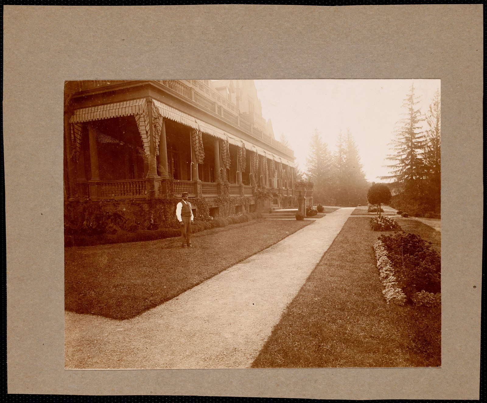 Ventfort Hall: estate worker in front of porch. about 1893.