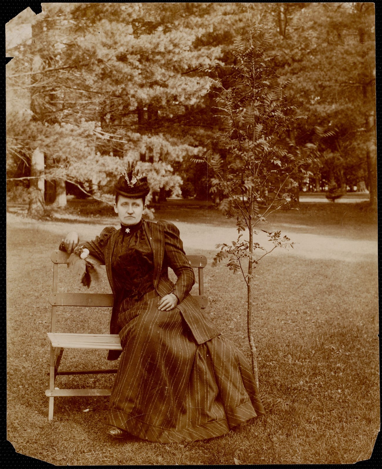 Ventfort Hall: Mrs. Tornquest[?] sitting on the Morgan grounds. about 1893.