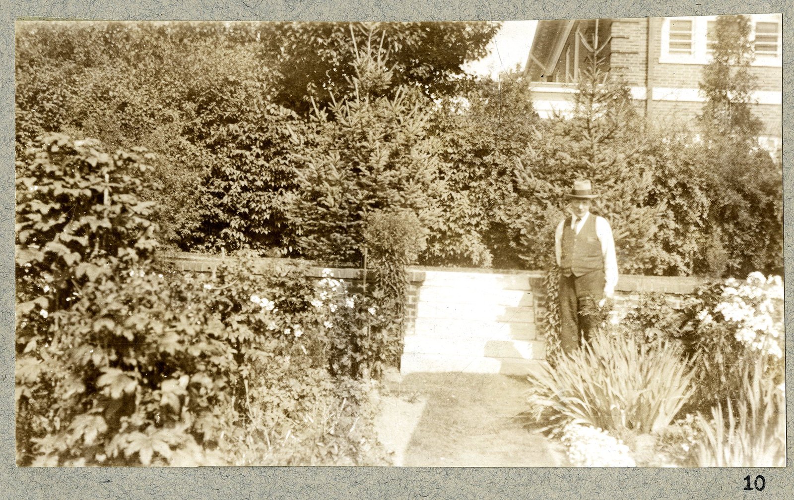A path between beds, with a figure standing at the end of it. Print 10.