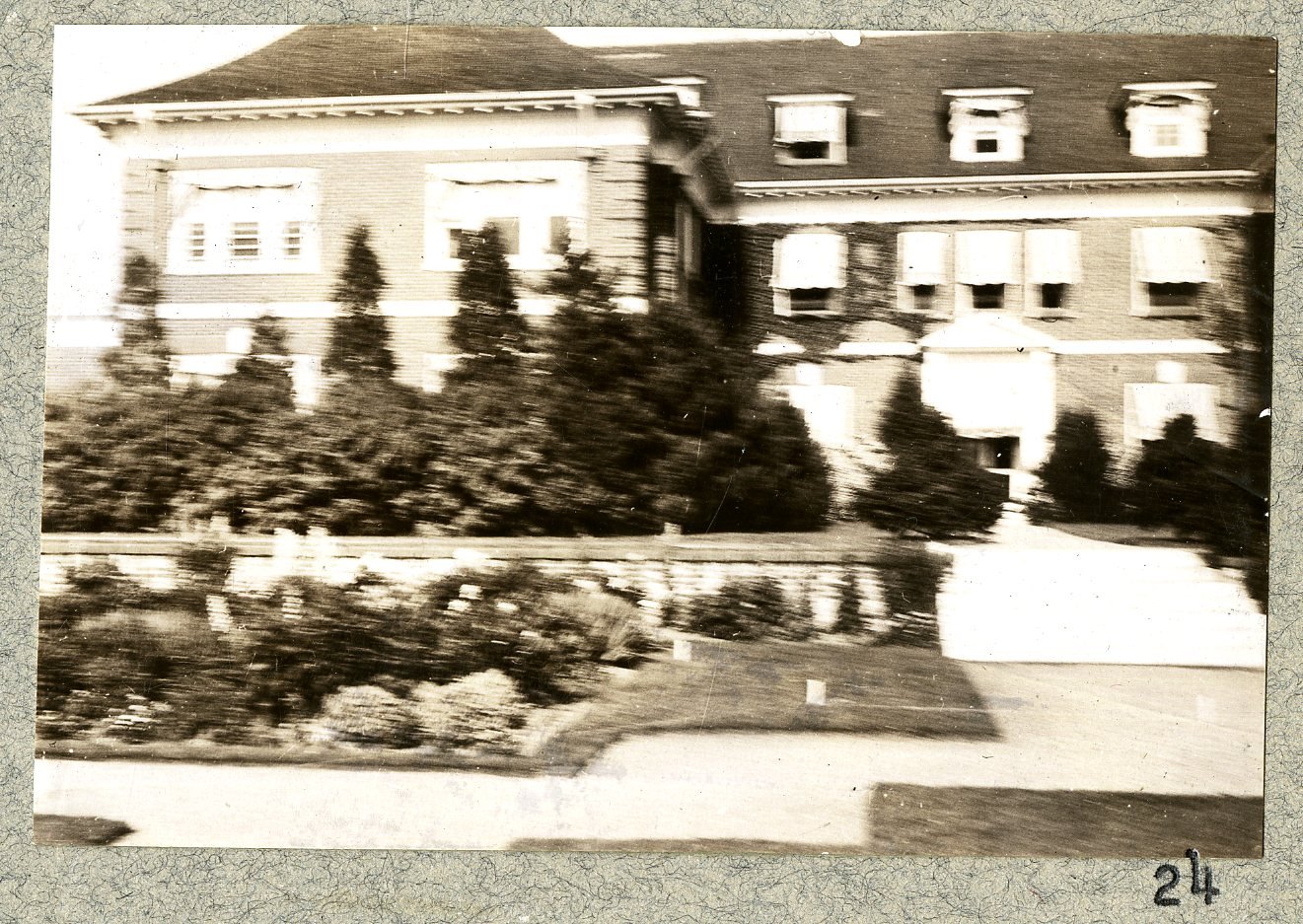A two-part panorama, mounted A and B, of the house front with its foundation planting. Print 23.