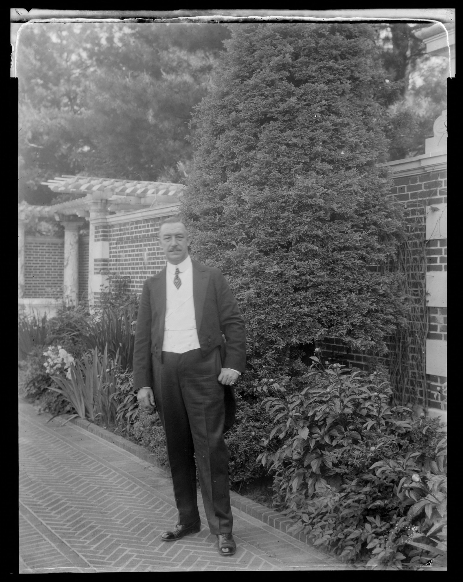 Brookside: man in garden. about 1920s.